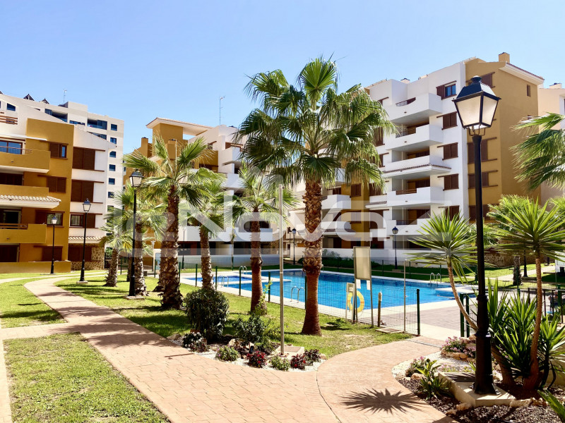 Incredible ground floor apartment with 2 bedrooms, spacious terrace and covered parking next to the beach in La Recoleta Punta Prima.. #1310