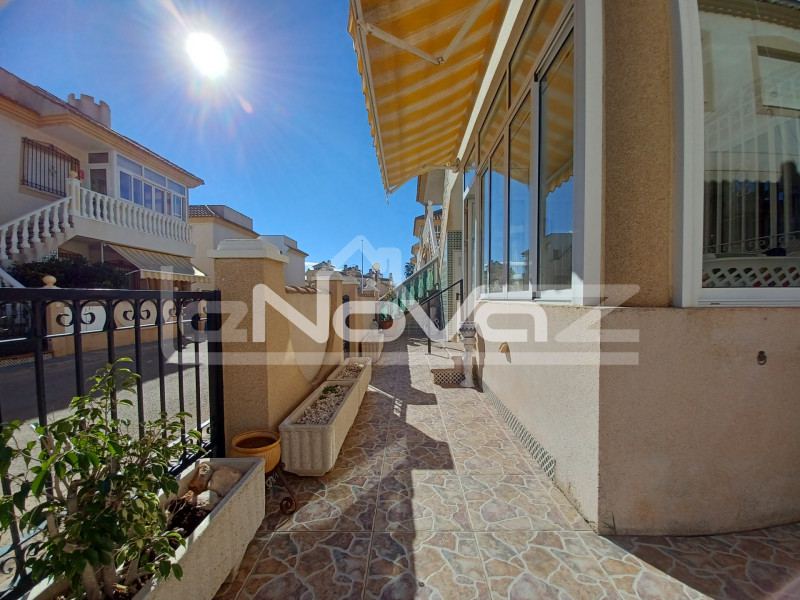 Spacious ground floor apartment with 2 bedrooms with large terrace and garden plot in a beautiful urbanization in the center of La Zenia.. #1344