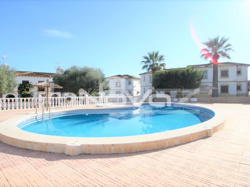 Ground floor apartment overlooking the communal pool in a gated residential area.. #1377