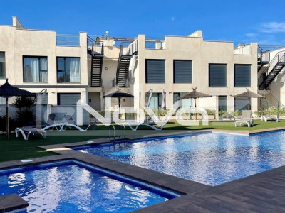 Modern detached villa located in a beautiful gated complex with a stunning communal pool and underground parking.
